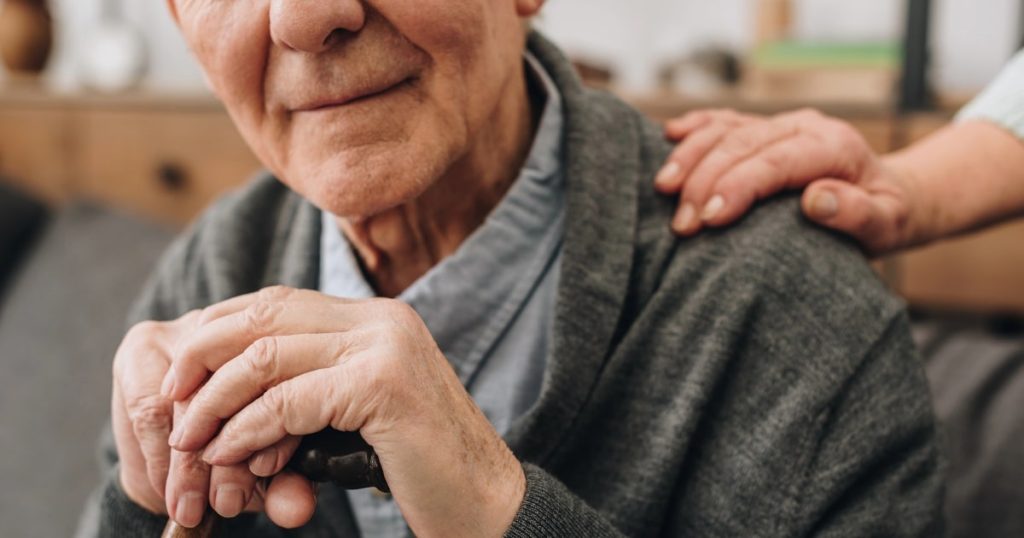 Close up of older man, with a hand on his shoulder, illustrating concerns about guardianship or administrator.